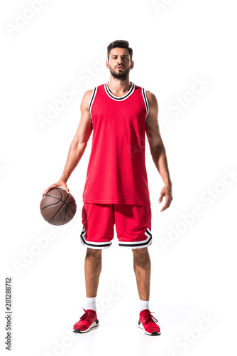 handsome athletic basketball player in red uniform with ball Isolated On White © LIGHTFIELD STUDIOS