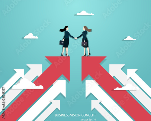 Business women partners handshaking over business