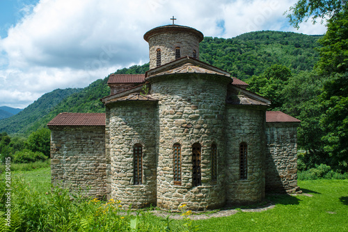 10th century ancient Christian church, Nizhnearhizy temples, Northern Zelenchuk temple, stone temple among mountains and vegetation photo