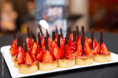 Catering food: dessert, mini canapes, sweetmeat. Food for the event. Depth of field photo