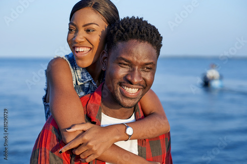 Romantic couple standing at the sea, portrait