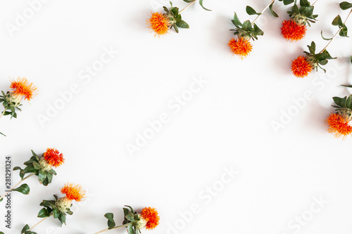 Autumn composition. Frame made of orange flowers on white background. Autumn, fall concept. Flat lay, top view, copy space