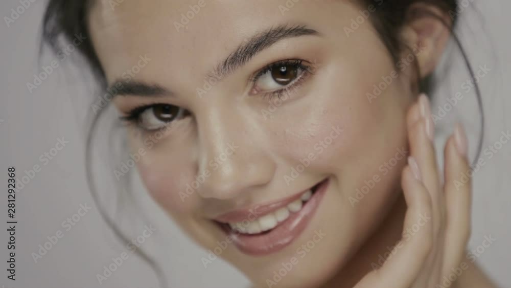 cute girl with clean skin and glossy lips massaging her under eye zone cute girl with clean skin and glossy lips massaging her under eye zone