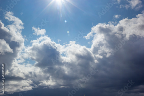 Sun Above Day Cloudy Blue Sky with White Clouds