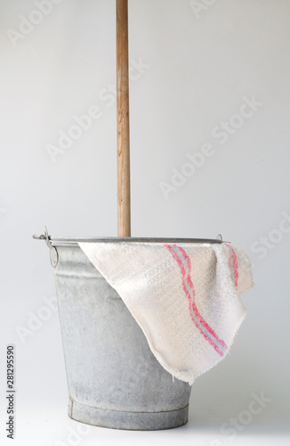 Old fashioned housekeeping with zinc bucket photo