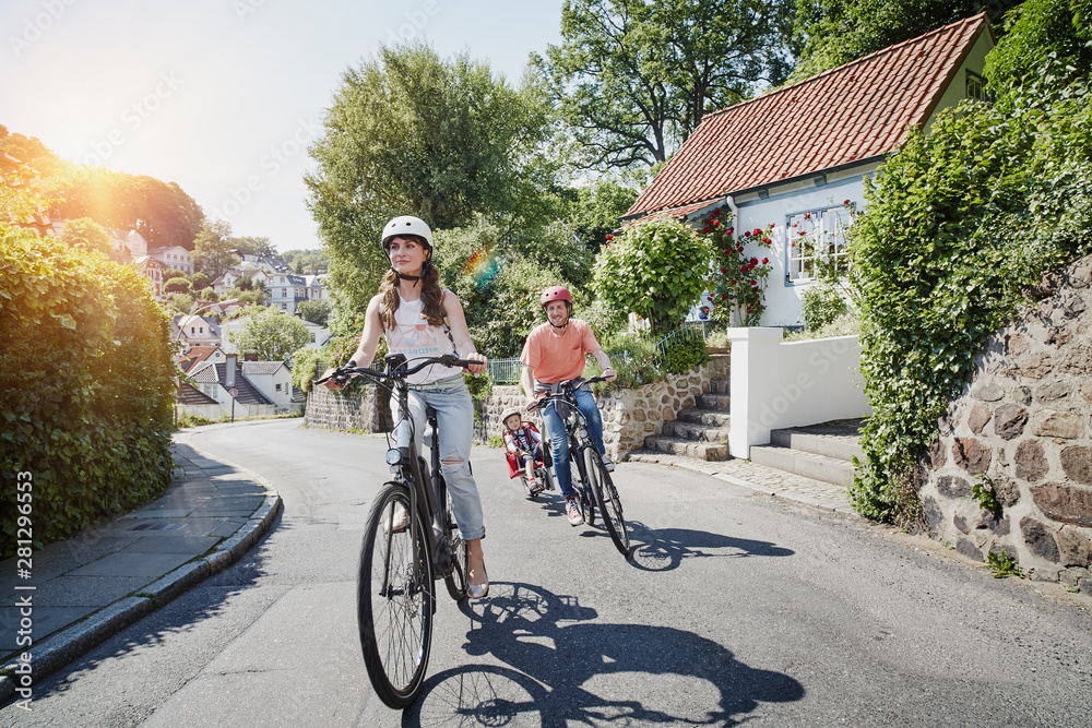 Germany, Hamburg, Blankenese, family riding e-bikes Germany, Hamburg, Blankenese, family riding e-bikes