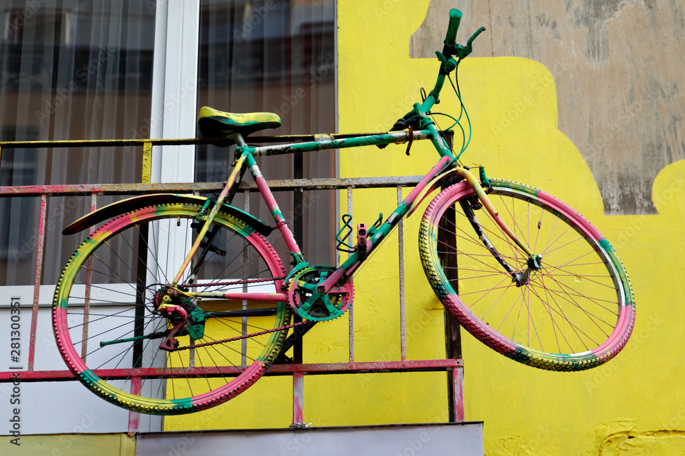 Old bicycle on the yellow wall