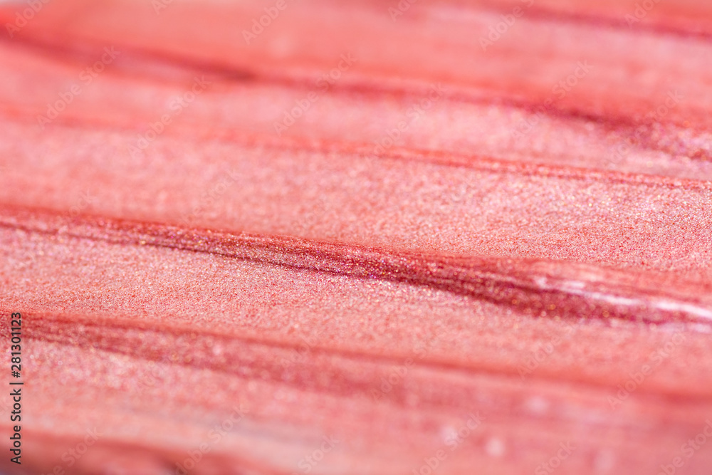 Texture of lip gloss. Smudged makeup product sample. Sparkling background Texture of lip gloss. Smudged makeup product sample. Sparkling background