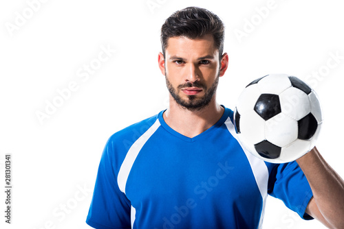 Fototapeta Naklejka Na Ścianę i Meble -  handsome soccer player looking at camera and holding ball Isolated On White