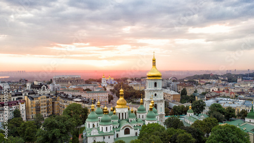 Saint Sophia's Cathedral, square. Kiev Kiyv Ukraine with Places of Interest. Aerial drone video footage. Sunrise light. City panarama. Summer time. Dnipro river and bridge. City center