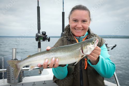Arctic char fishing trophy in female hands
