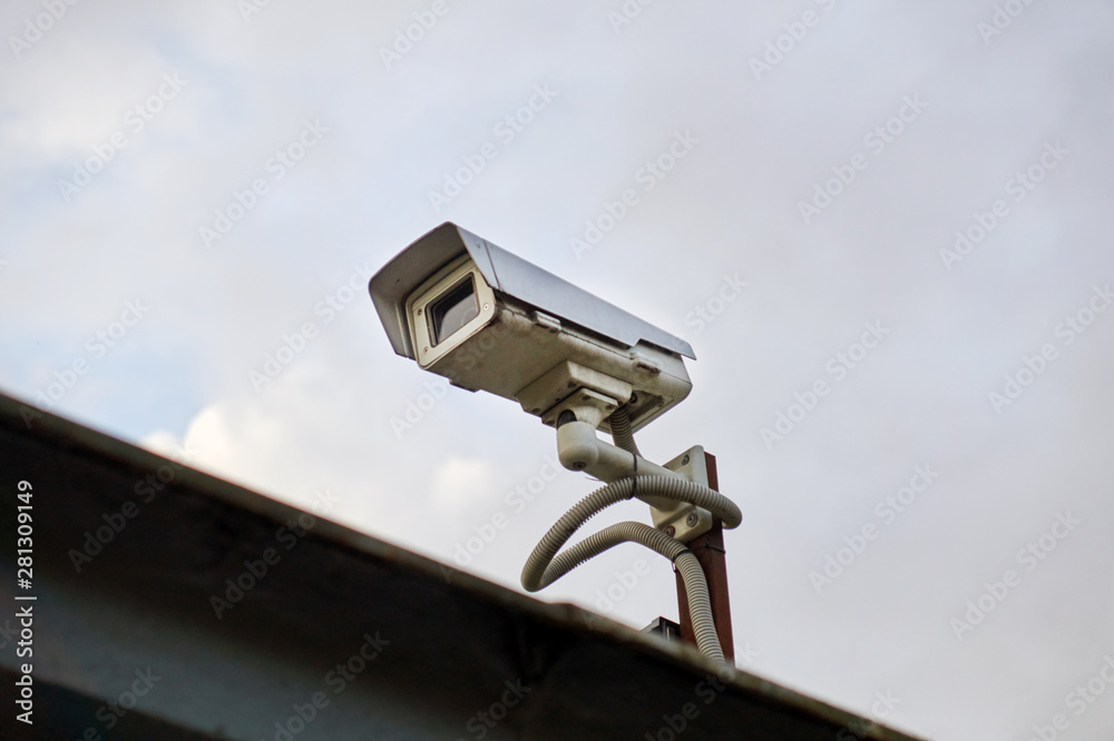 outdoor video camera on a cloudy sky background outdoor video camera on a cloudy sky background