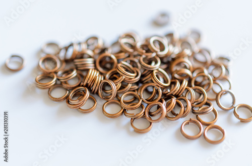 Jewelry findings connecting double rings, handmade craft concept.