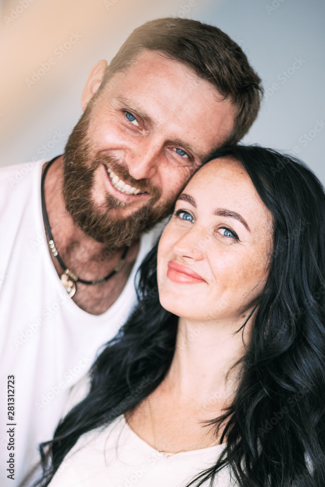 Loving couple woman and man with beard soft light from window Loving couple woman and man with beard soft light from window