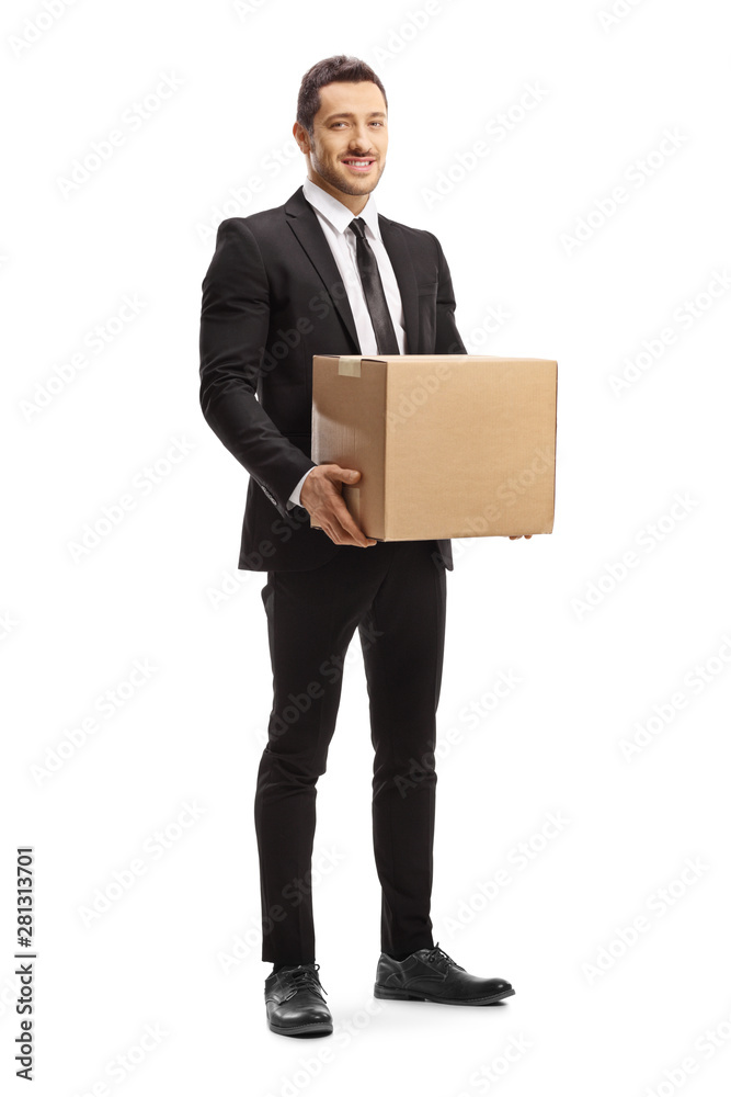 Man in a suit holding a cardboard box Man in a suit holding a cardboard box
