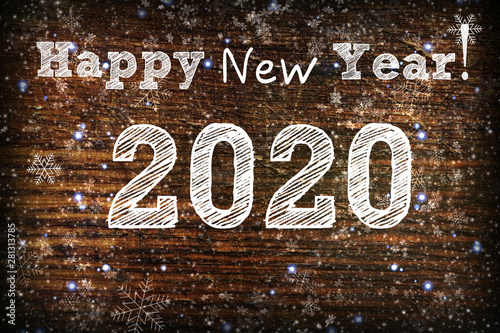 2020. Texture dark wood ilfri 2020.New year background. Retro wooden table. Rustic background. White snowflakes , snow, bokeh. Copy space. photo