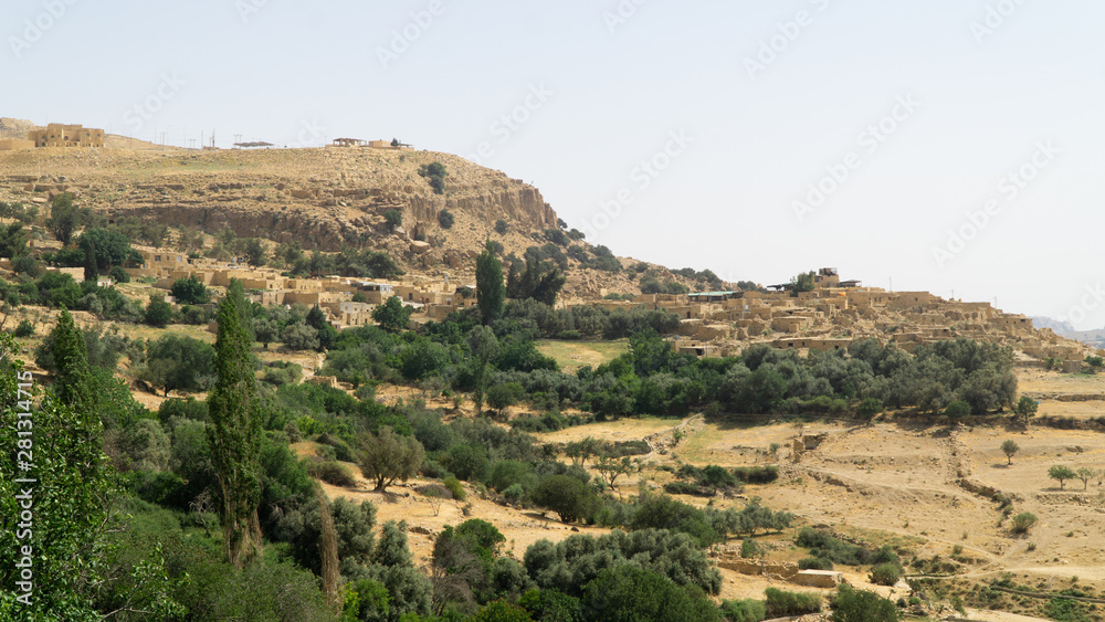 View of the Dana village situated on the edge of the Dana Reserve, panoramatic view of typical middle east landscape, Jordan.