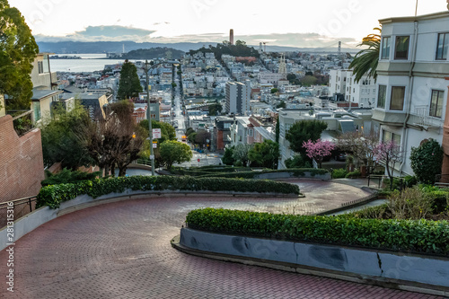 Crooked Lombard street at  dawn. San Francisco is in early morning light. photo
