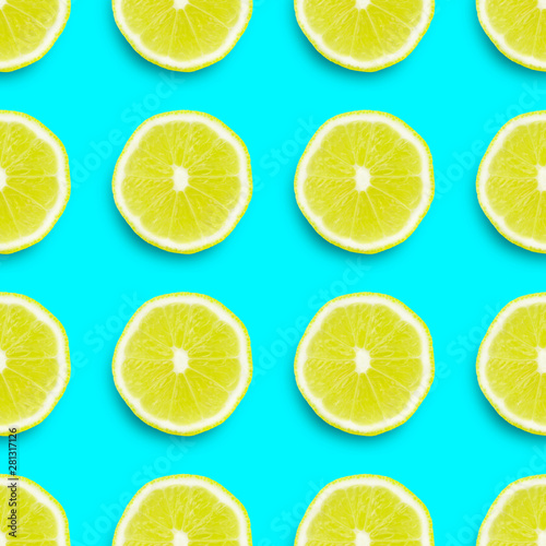 seamless texture,  lemon sliced ​​into rings on a colored background