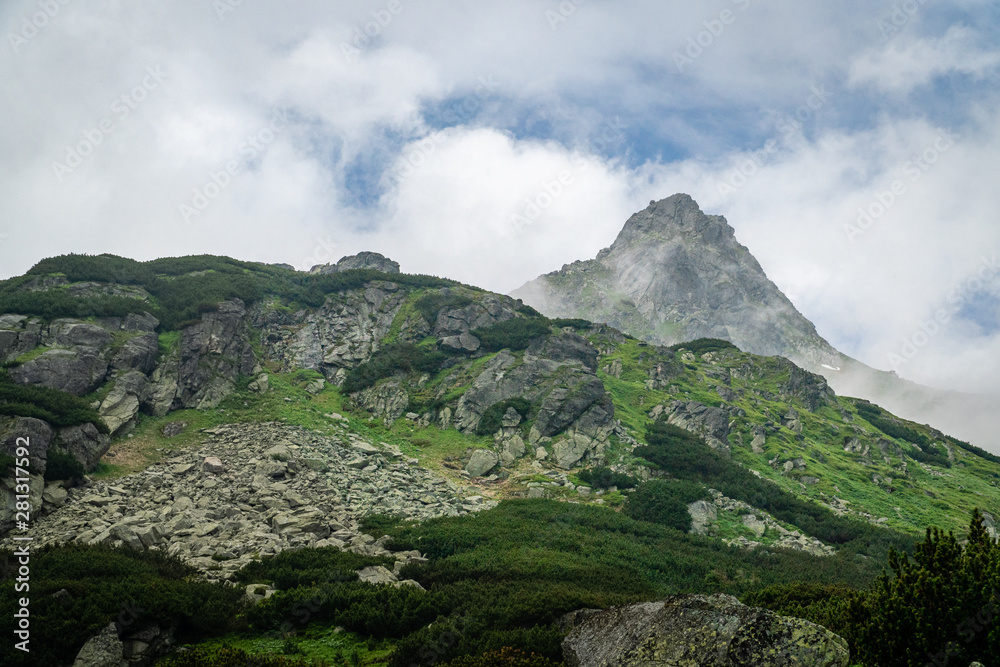 High Tatras mountain range valley covered with clouds High Tatras mountain range valley covered with clouds