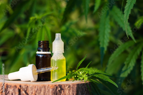 Hemp CBD oil pipette, marijuana oil bottle, cannabis extracts in jars, medical marijuana, alternative medicine