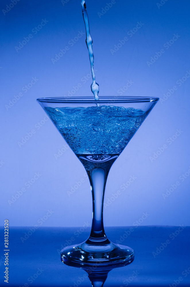 blue cocktail with splash isolated on white blue cocktail with splash isolated on white
