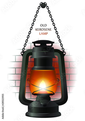 Old kerosene lamp on the brick wall fragment.
