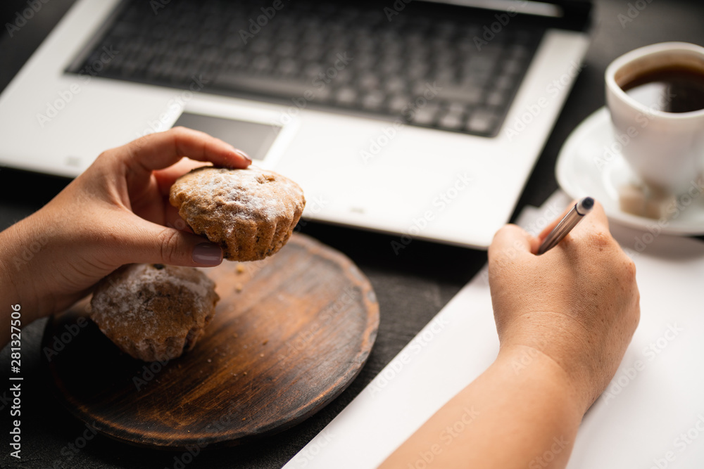 Unhealthy snack at work time. Compulsive indulgence, overeating, stress