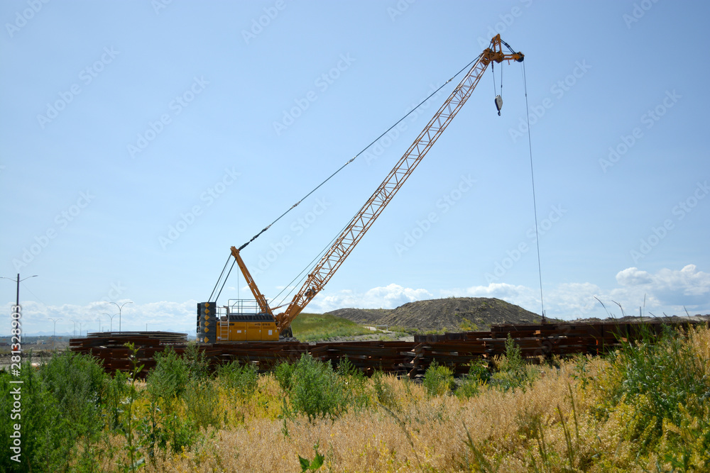 Crane equipment working on highway construction site