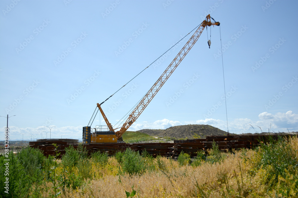 Crane equipment working on highway construction site Crane equipment working on highway construction site