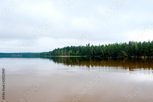 Forest lake, early autumn morning, Karelia, Russia, north. forest landscape reflected in water