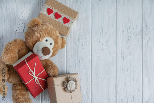 Design of the congratulatory banner with boxes and a toy bear on a white background. Frame for birthday greeting card. Sale and gifts, store promotions