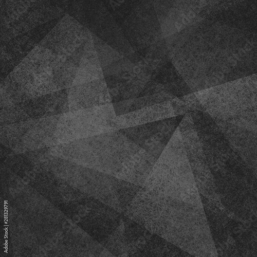 Abstract black background with texture and triangle shapes layered in random pattern in elegant business or website layout design