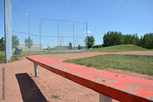 Bench at basefield field at a local community park.