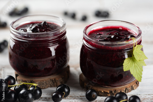 Obraz na płótnie Two jars with black currant jam w salonie