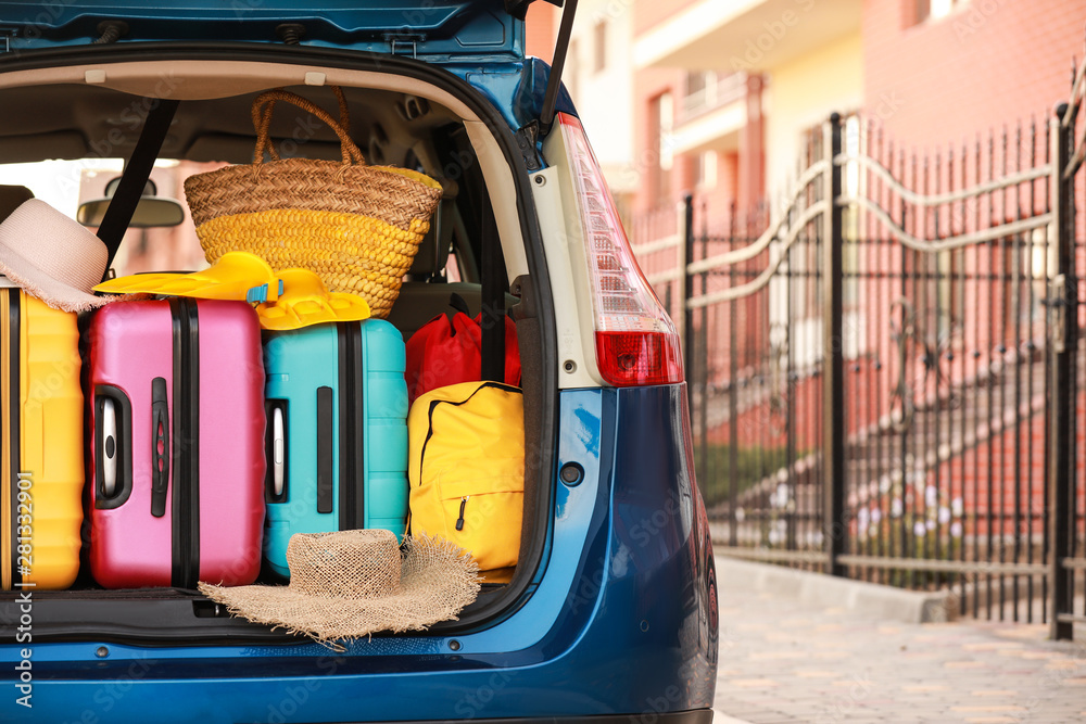 Modern car with luggage outdoors Modern car with luggage outdoors