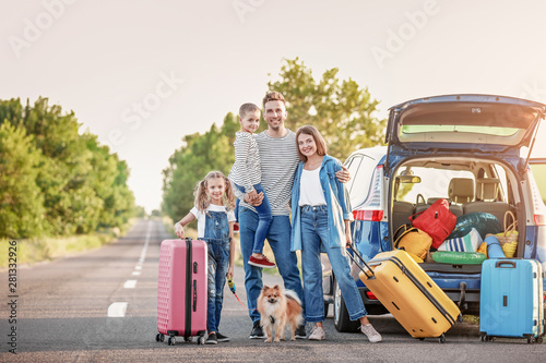 Happy family with luggage n...