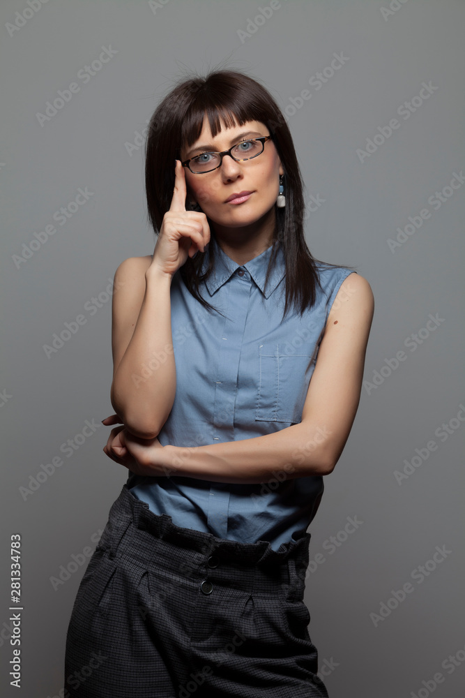 Headshot of gorgeous young woman with eyeglasses
