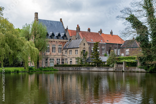 A lake reflects the beautiful architecture on display in the quaint village of Bruges, Belgium