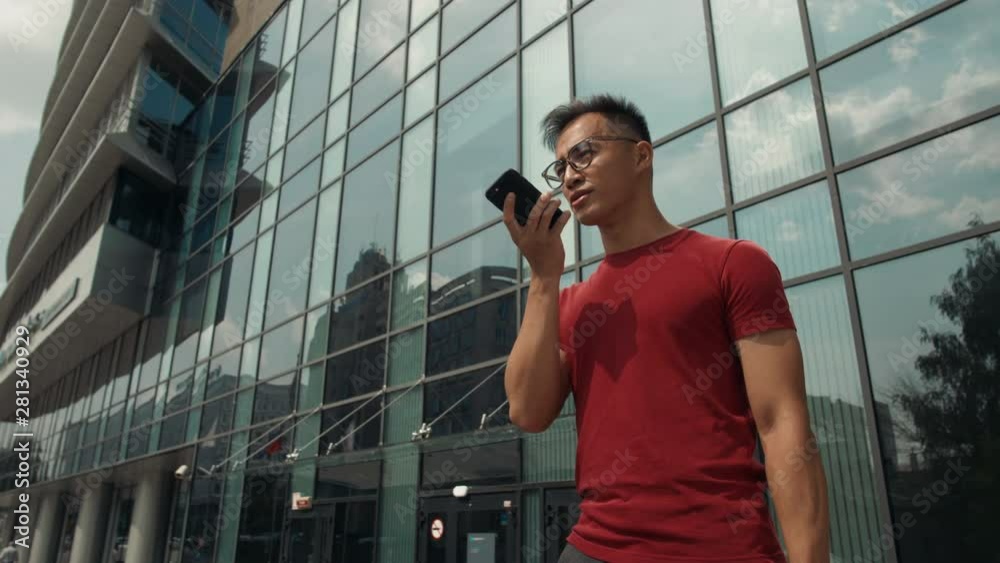Asian korean man voice recognition with smart phone in railway station train public transportation, audio message helper student in university business center office happy