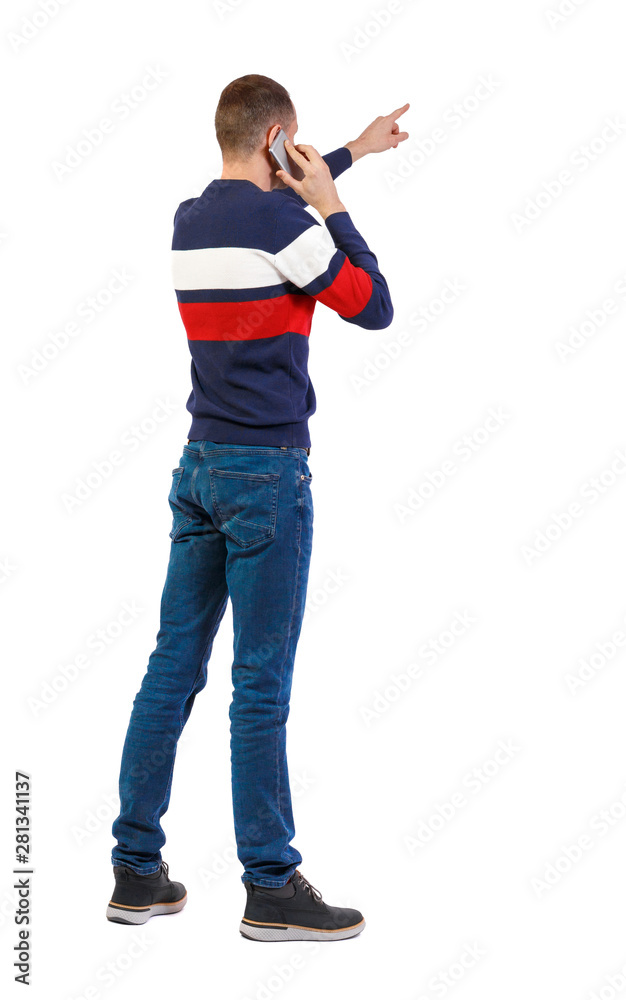 Back view of pointing young men talking on cell phone. Back view of pointing young men talking on cell phone.