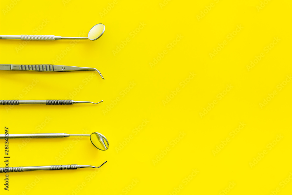 dentist desk with instruments on yellow background top view mockup
