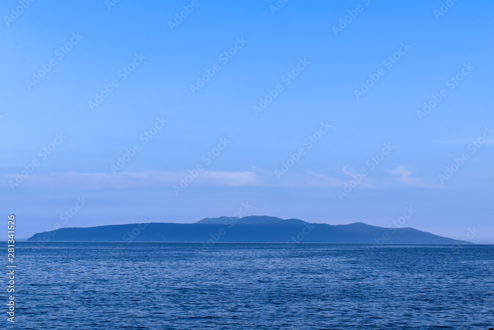 Twilight seascape from Opatija riviera in Croatia. Silhouette of Cres island. Twilight seascape from Opatija riviera in Croatia. Silhouette of Cres island.