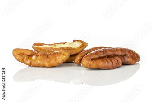 Group of one whole two halves of fresh brown pecan nut half isolated on white background