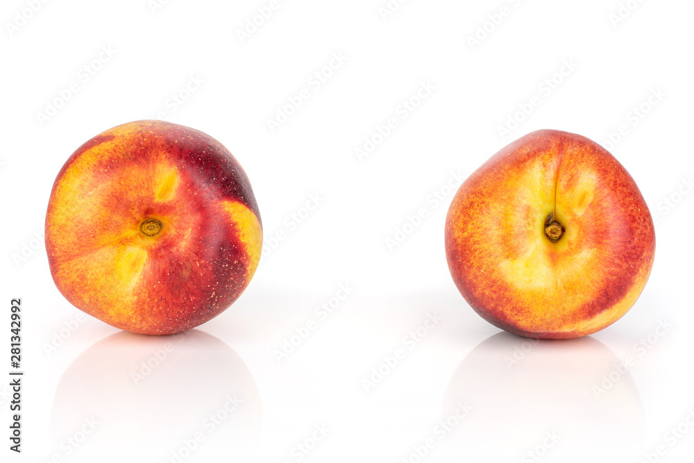 Group of two whole fresh red nectarine isolated on white background Group of two whole fresh red nectarine isolated on white background