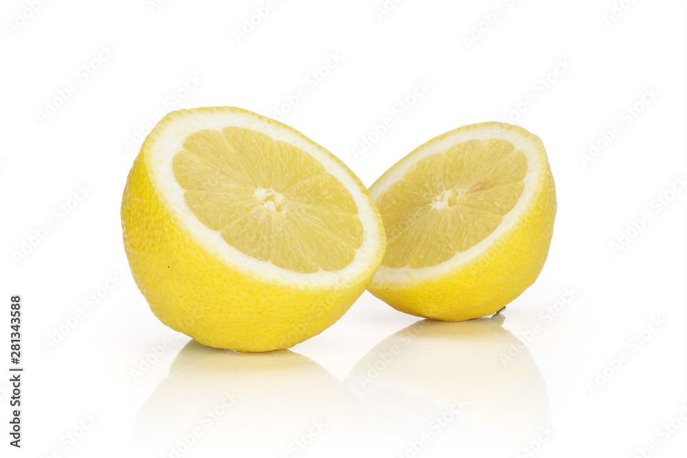Group of two halves of fresh yellow lemon isolated on white background