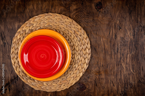 Obraz na płótnie Empty plate with fork and knife on colored wooden background, top view, copy space, mock-up w salonie