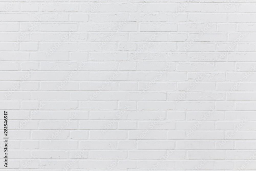 Simple white brick wall with light gray shades seamless pattern surface texture wide format background.