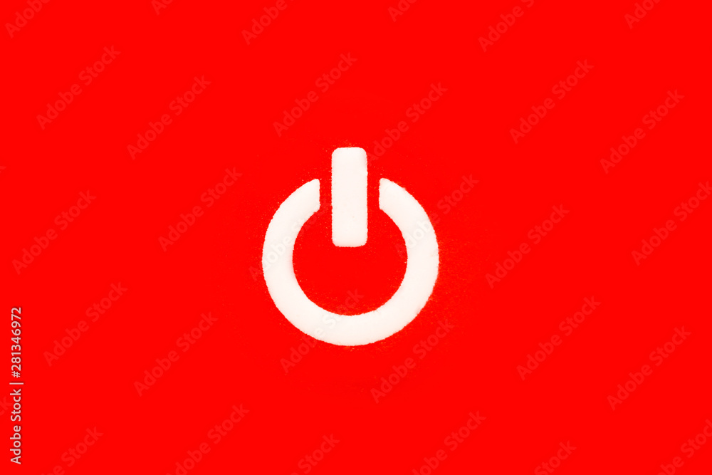 Power button (on and off) or switch white symbol macro photography and isolated on a seamless intense red background. Power button (on and off) or switch white symbol macro photography and isolated on a seamless intense red background.