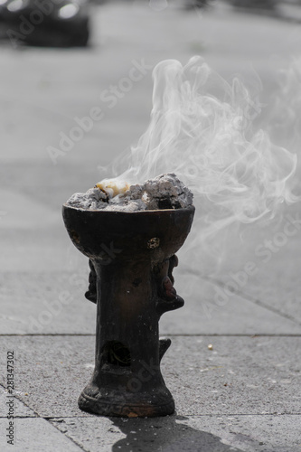 Brasero de barro negro para quemar incienso o copal, humo aromático de tradición durante rituales de danza azteca photo